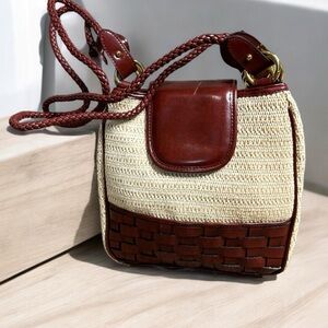 Vintage leather woven wicker straw  
burgundy leather crossbody shoulder bag.